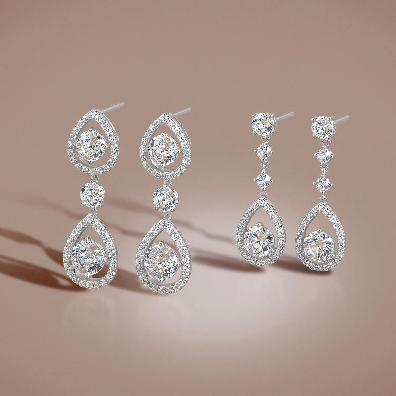 Regalia: Silver rhodium plated with 5.5mm CZ millenia pear drop earrings
